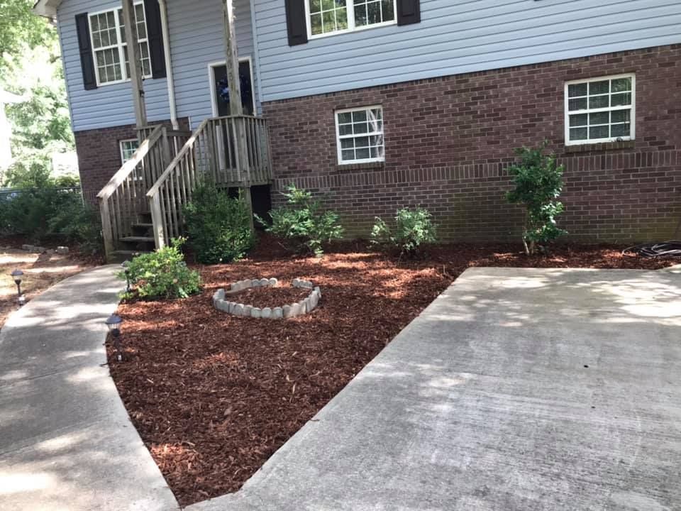 Enhance your garden with our professional mulch installation service, providing superior weed control, moisture retention, and soil improvement. Refresh your landscape effortlessly while boosting curb appeal and protecting plant health year-round. for Watson Lawn Care in Hillsboro, TX