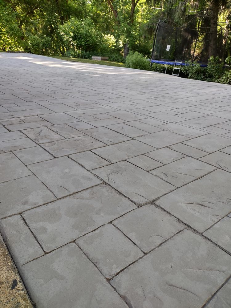 Our Stamped Concrete Installation service transforms your home's exterior with beautiful, durable designs that mimic natural stone or brick, enhancing aesthetic appeal and increasing property value while providing long-lasting quality. for CTE Concrete in Kaysville, UT
