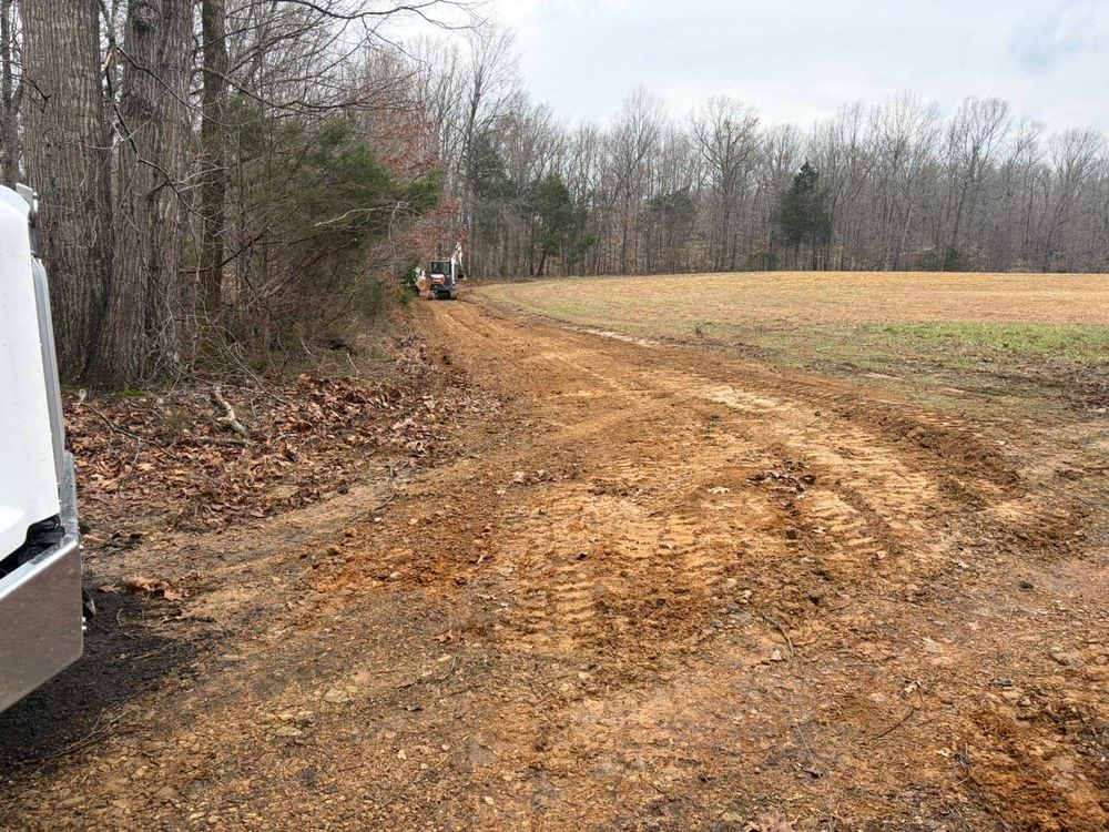 Our Site Grading service ensures a level and stable foundation for your construction project, enhancing drainage and preventing future issues by carefully reshaping the land to meet your specific needs. for Yates Construction & Excavation in Arrington, Tennessee