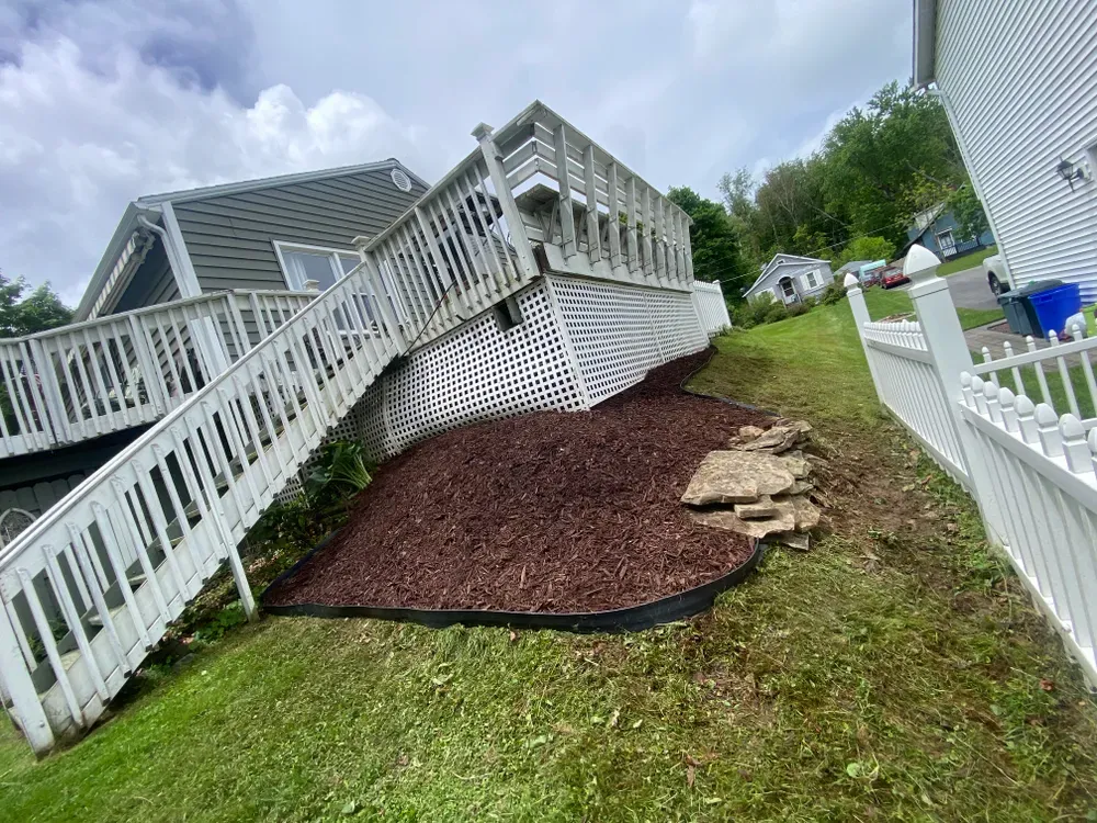 Our mulch installation service enhances soil health, retains moisture, and adds beauty to your landscape. Trust our experts to professionally install high-quality mulch that complements your garden and boosts plant vitality. for Licensed to Cut Tree Service in Athens, PA