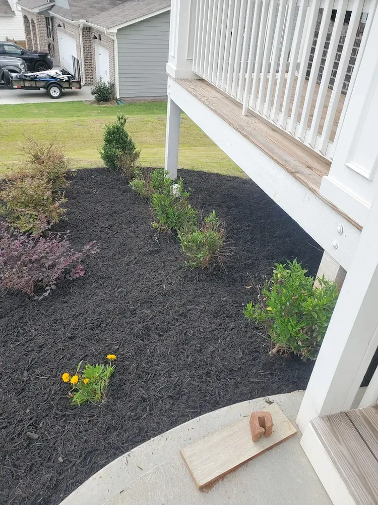 Enhance your landscape with our professional Mulch Installation service, providing a neat appearance while retaining moisture, reducing weeds, and improving soil health for a vibrant and well-maintained lawn. for Palmour's Lawn Care in Gainesville, GA
