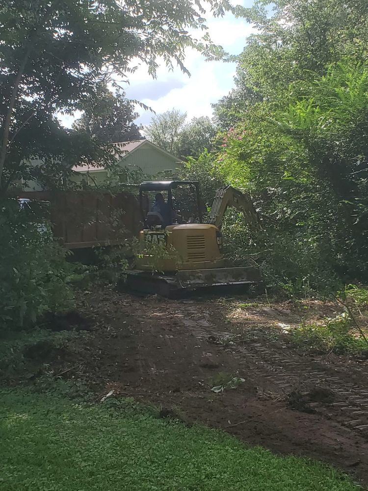 Our Land Clearing service efficiently removes trees, brush, and debris from your property to create a cleared space for various purposes such as landscaping, construction projects or fire prevention. for Puckett's Tree Service in Decatur County, TN