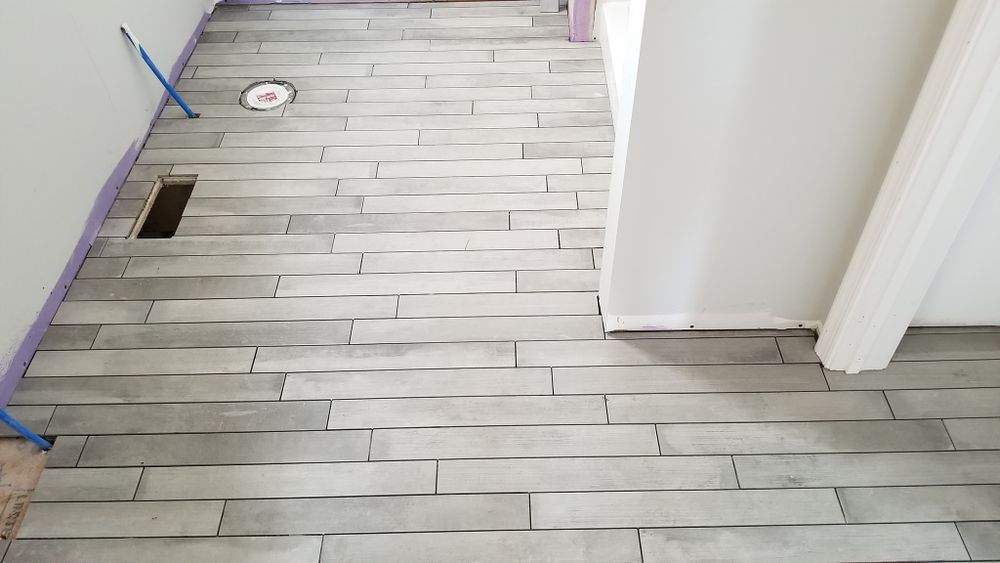 Transform your home with our exceptional flooring services. We offer a wide range of durable and stylish tiles, expert installation, and superior customer care to enhance any room's aesthetic appeal. for Proper Fix Tiling & Handyman Services in Orefield, PA