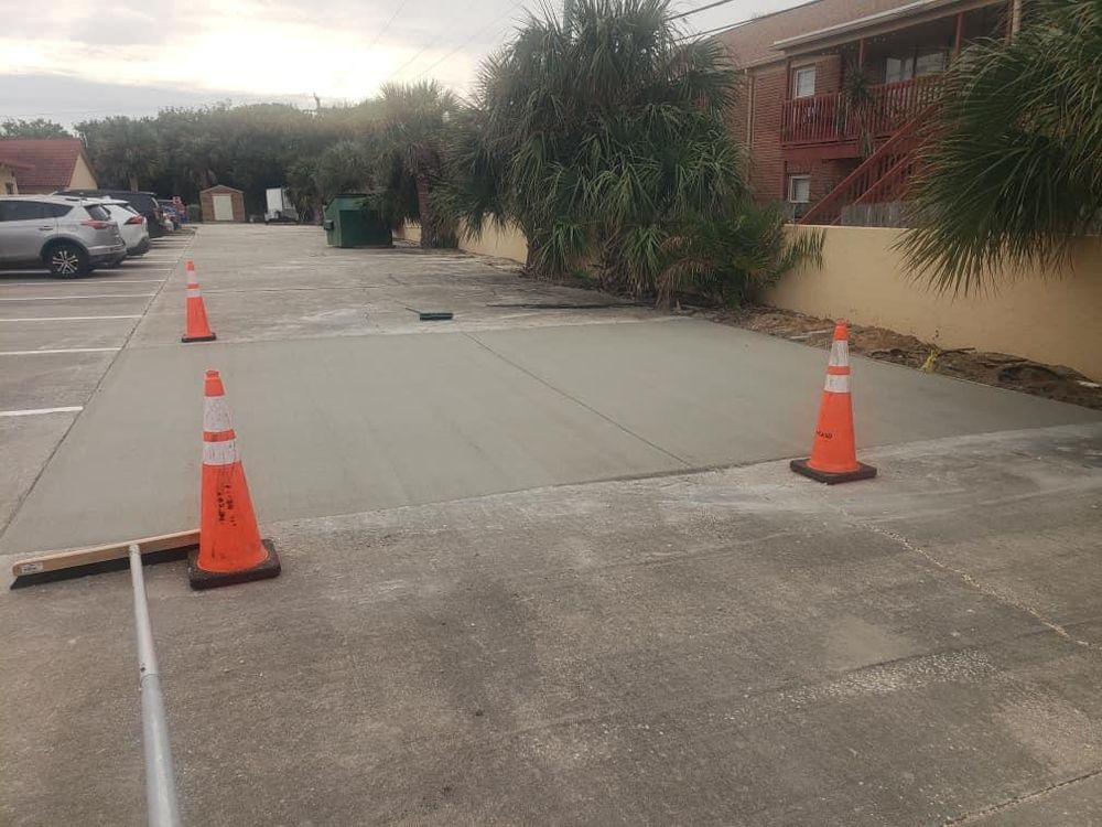 Our Parking Lot Repairs and Curbing service provides customers with professional concrete repairs for their parking lots, ensuring safety and enhancing the overall appearance of their property. for Green Hammer Concrete in Palm Bay, Florida