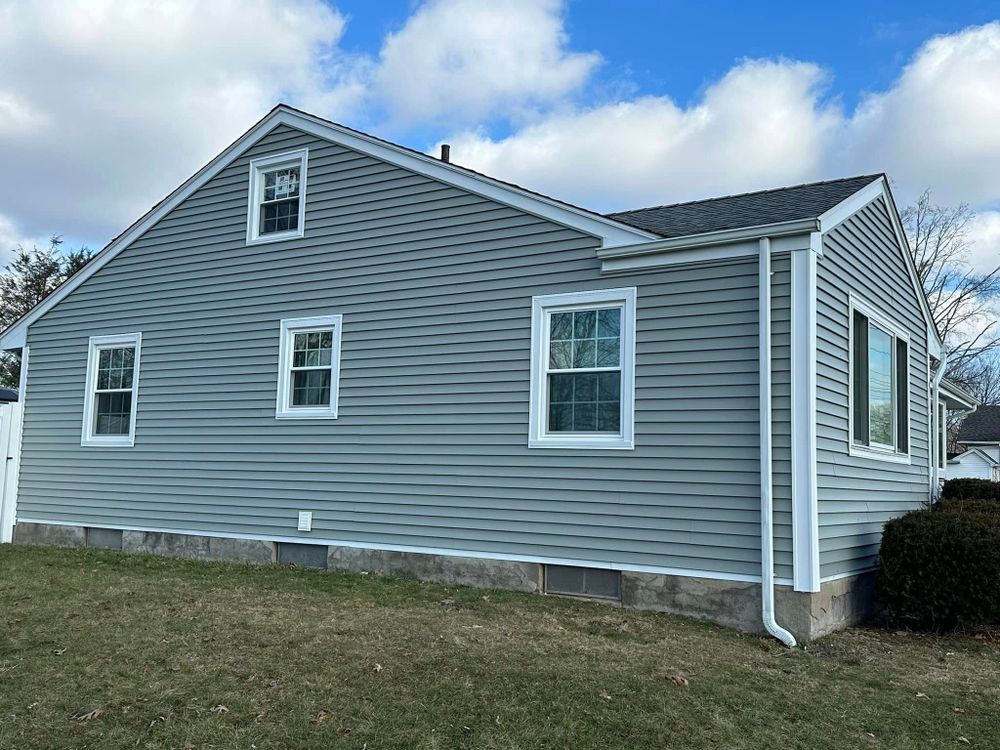 Transform your vinyl siding house with our expert siding services, offering durability and aesthetic appeal. Enhance curb appeal and protect your home efficiently through professional installation by our skilled team. for Simone Builders in Orange, CT
