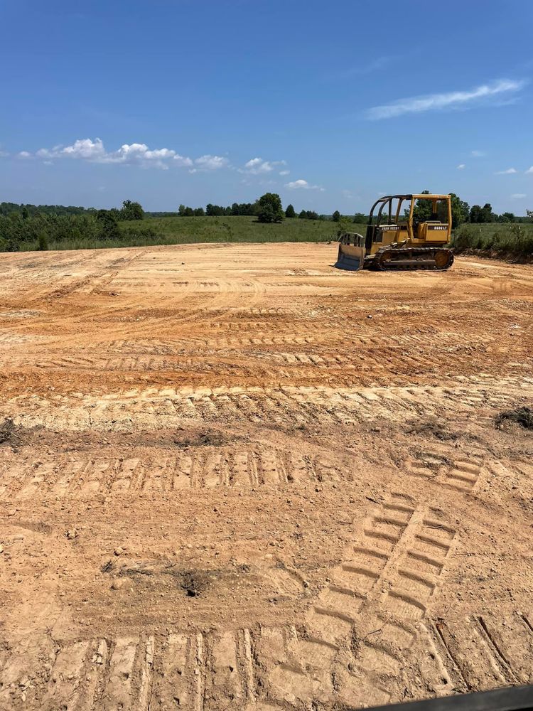 Our Land Grading service ensures a smooth, level surface for your property, improving drainage and foundation support. Enhance curb appeal and prepare your landscape perfectly with our professional expertise. for Double V Services in Dickson, TN