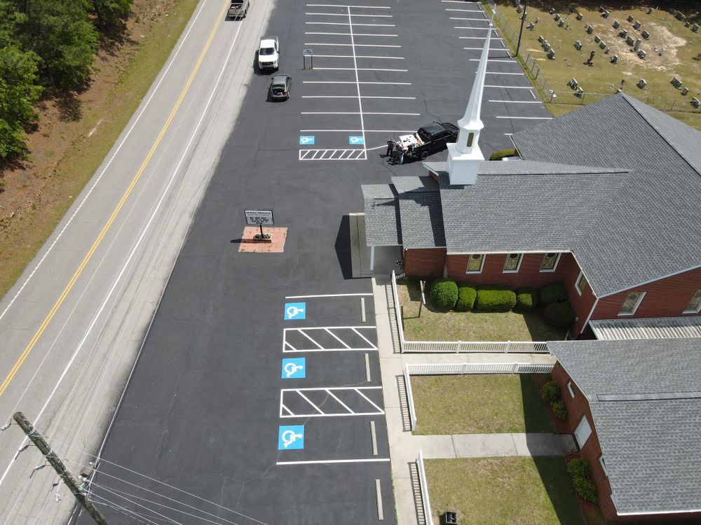 Our Commercial Asphalt Services ensure durable, high-quality paving solutions for businesses. From parking lots to pathways, we deliver reliable results that enhance safety and curb appeal in any commercial setting. for Blacktop Sealcoating in Hartsville, SC