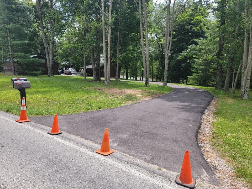 Our professional sealcoating service protects and extends the life of your driveway by preventing cracks and damage from weather, offering a durable, smooth surface that enhances curb appeal. for Smith's Paving and Sealcoating in Rushville, IN