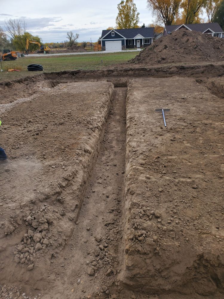 Our trenching service expertly creates precise underground channels for utilities, drainage, and landscaping projects. Trust our skilled team to ensure efficient installation with minimal disruption to your property’s appearance and integrity. for Precision Excavation and Septic Systems in Sheridan, WY