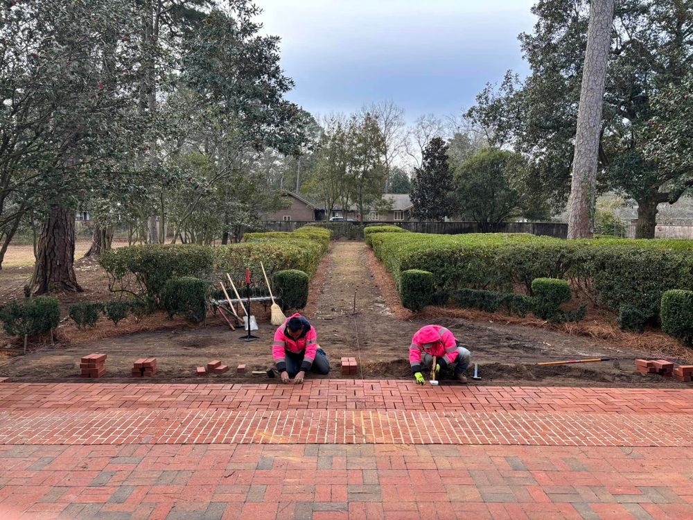 Our Patio Design & Construction service offers homeowners the opportunity to transform their outdoor living spaces with beautiful and functional patio designs, built with precision and quality craftsmanship. for Pink Pelican Tree Service & Landscaping in Columbia, SC