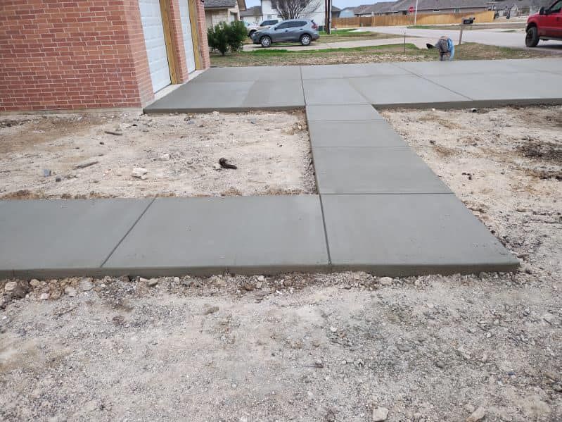 Enhance your home's curb appeal and functionality with our professional Sidewalk Installation service. Our experienced team will expertly install durable concrete sidewalks to enhance the overall beauty of your property. for Merino Concrete Construction LLC in Liberty Hill, TX