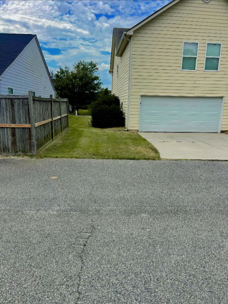 Our residential lawn care services include expert hedge trimming to enhance your home's curb appeal. Our team ensures precision and care, shaping your hedges to perfection for a beautifully manicured landscape. for Clark's Cuts Lawn Care in Lilburn, GA