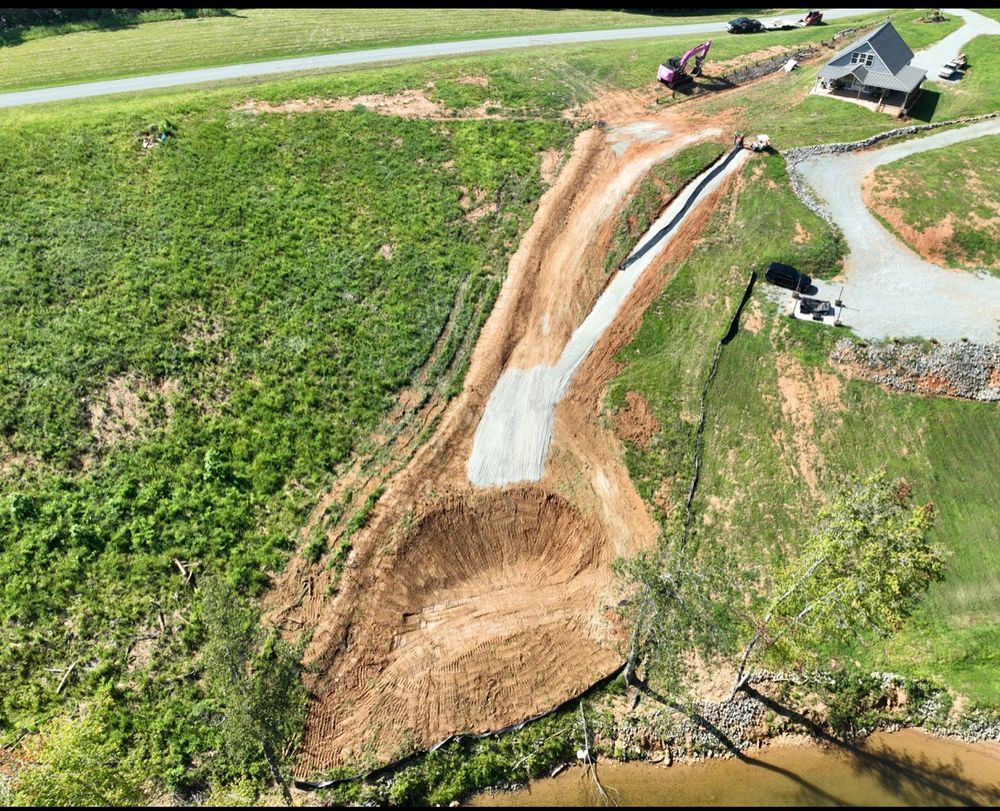 Our grading and leveling service creates a stable, properly sloped surface for construction, drainage, and landscaping, helping homeowners prevent water issues, improve usability, and prepare their property for lasting results. for Hunt’s Hauling & Landworks LLC in Danville, VA