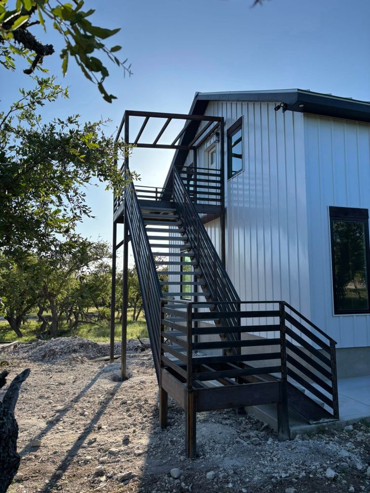 Our Stair Construction service designs and builds safe, durable, code-compliant stairs for metal buildings, enhancing access, functionality, and appearance with precision craftsmanship tailored to your property’s needs. for Twisted K Construction in Center Point, TX