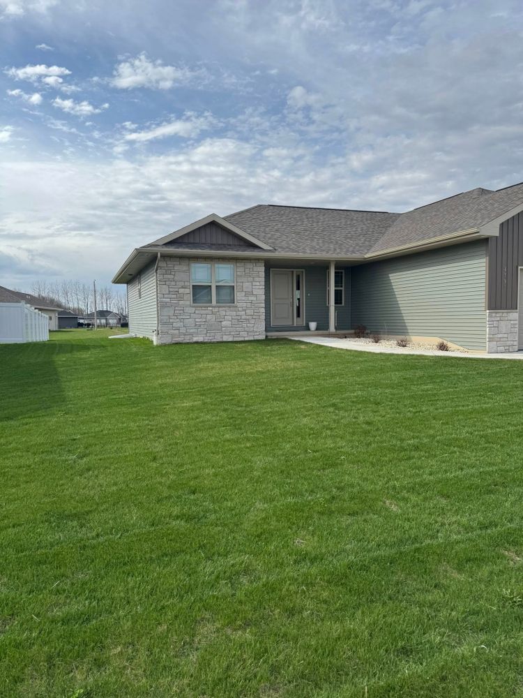 Our Lawn Installation service rejuvenates your yard by expertly laying new turf while incorporating lawn dethatching techniques to ensure healthy, lush growth and a vibrant green landscape for your home. for Stitch's Landscape in Howard, WI