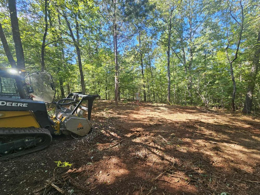 Our Forestry Mulching service efficiently clears overgrown land by transforming trees and brush into valuable mulch, enhancing your property's aesthetics while promoting healthy soil and preventing erosion. Ideal for environmentally-friendly landscape management. for O'Connor Clearing and Hauling LLC in Anderson County, SC