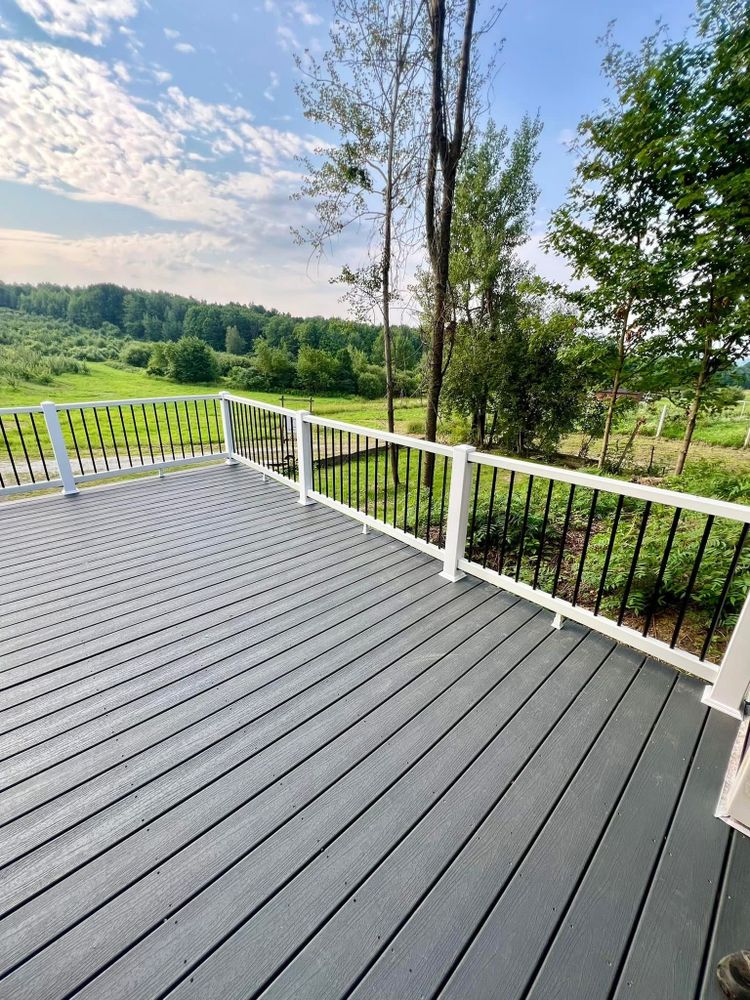 Our expert deck builders near me specialize in creating custom porches and decks, enhancing your outdoor space with durable materials and stunning designs for a perfect blend of functionality and beauty. for Bishop’s Property Maintenance in Franklin, VT