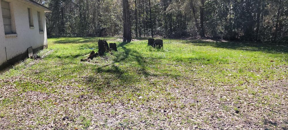 Our Fall Clean Up service ensures a pristine yard through leaf removal, debris cleanup, and plant care, preparing your landscape for winter while enhancing curb appeal and promoting healthy growth for spring. for Tyson’s Full Service Lawn Care in Starke, FL