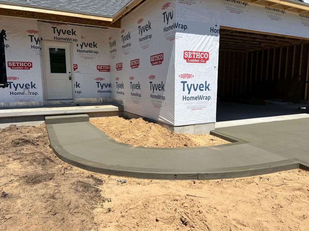 Our Sidewalk Installation service offers homeowners a durable and visually pleasing solution for enhancing their property's curb appeal while providing safe and functional pedestrian walkways. Contact us today for a consultation! for J&C Concrete in Fruitport,  MI