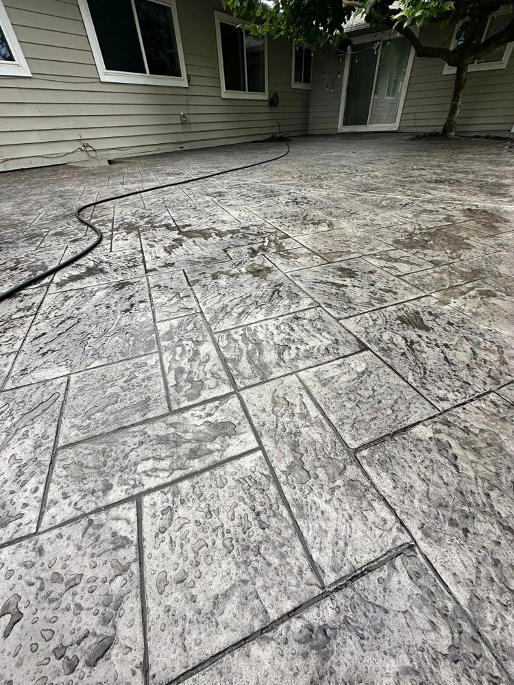 Transform your outdoor space with our stamped concrete installation service. Choose from a variety of patterns and colors to create a unique, durable, and low maintenance surface for your patio or driveway. for A Paradise Concrete & Construction  in  Renton,  WA