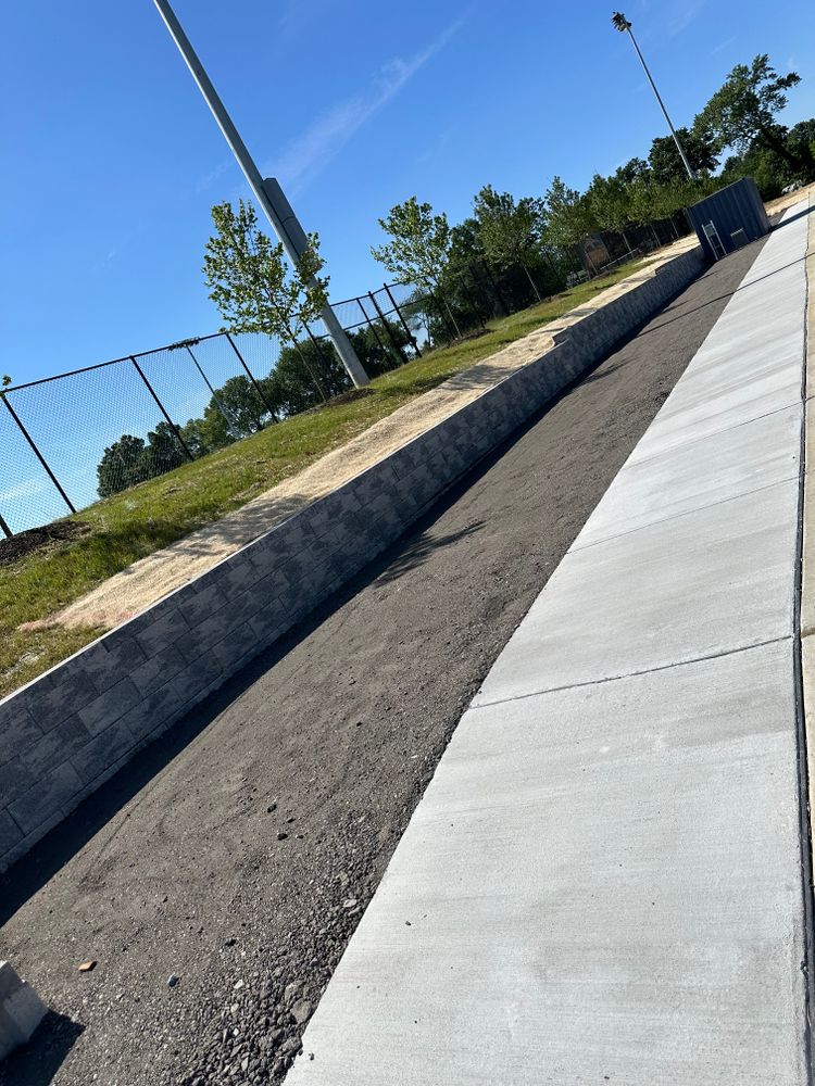 Our Retaining Wall Construction service provides durable and aesthetically pleasing solutions, enhancing your landscape by preventing soil erosion while adding functionality and beauty to your outdoor space. for RDR Landscaping, LLC in Columbia, MD