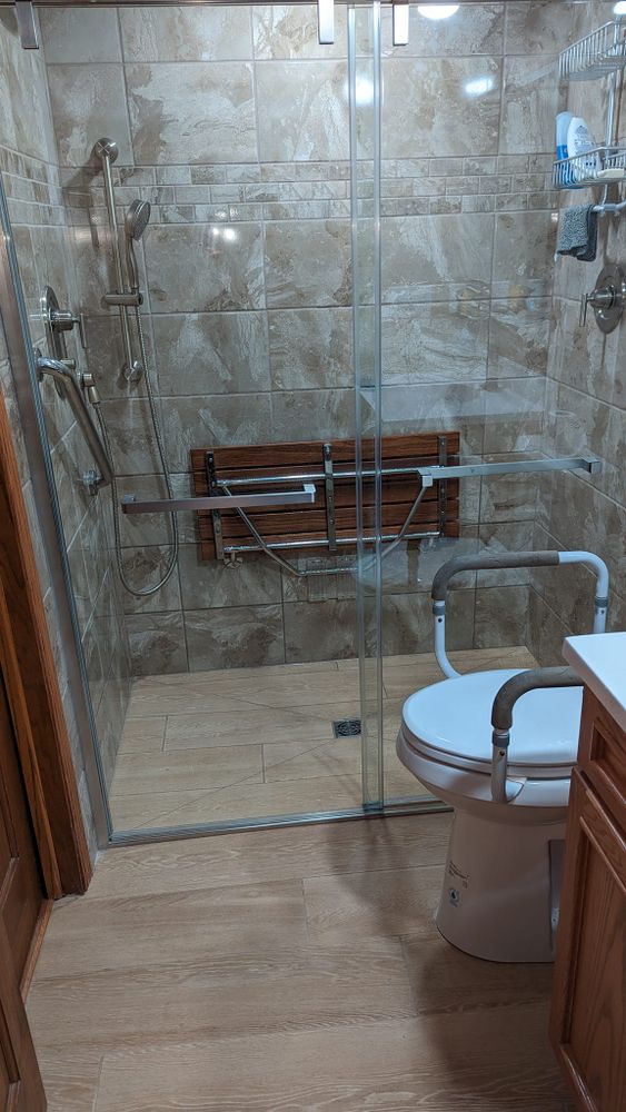 Transform your bathroom into a luxurious oasis with our expert Bathroom Remodels service. Our team will work closely with you to design and create the perfect space for your home. for New Millennium Construction Services Corp  in Wilmington, IL