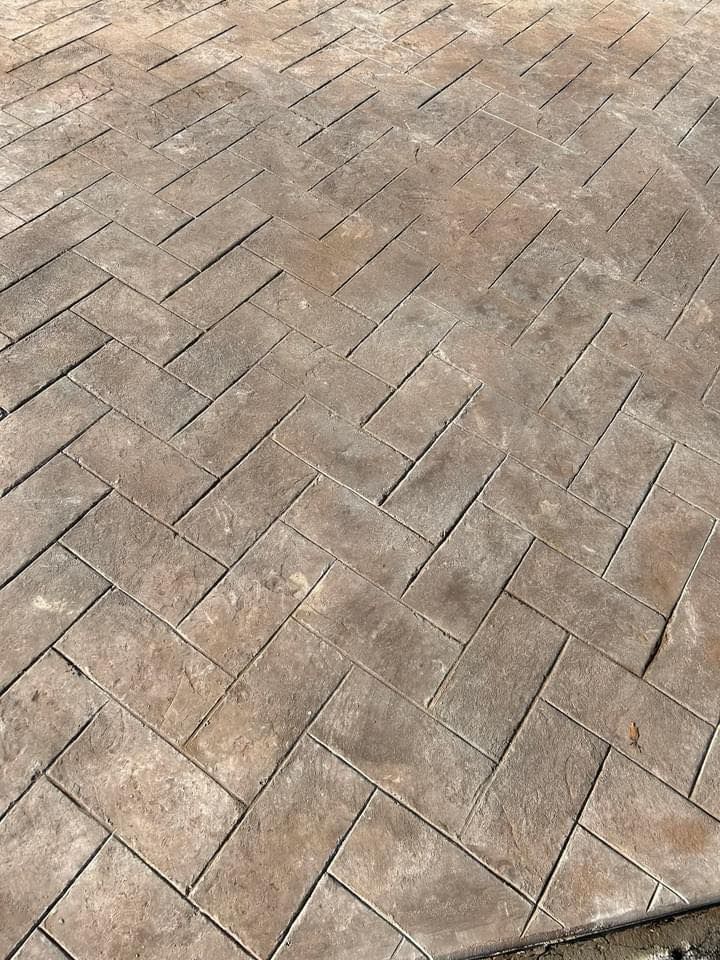 Our Stamped Concrete Installation service transforms outdoor spaces with durable, visually appealing designs that mimic natural stone or brick. Perfect for patios and driveways, enhancing both aesthetic value and functionality. for Brooke’s Masonry & Services in Apollo Beach, FL