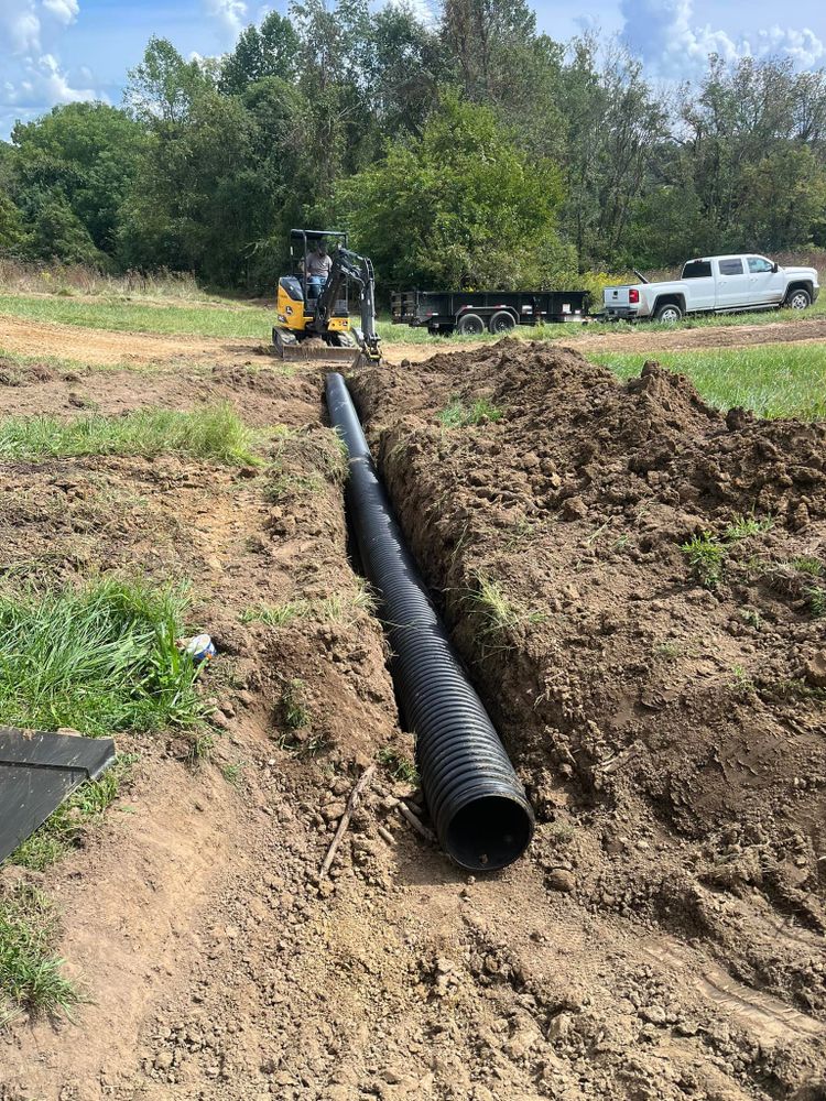 Our professional drainage service ensures efficient water management, preventing flooding and erosion. We expertly design and install systems tailored to your property's needs, ensuring lasting protection and peace of mind for homeowners. for KW Earthworks in Connersville, IN