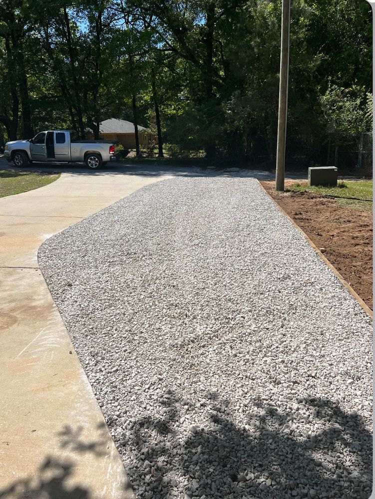 Our Tractor, Dirt/Rock Work service enhances your property by efficiently handling grading, leveling, and rock placement tasks to create a solid foundation for landscaping or outdoor projects in your landscape. for Southern Venom Services in Daphne, AL