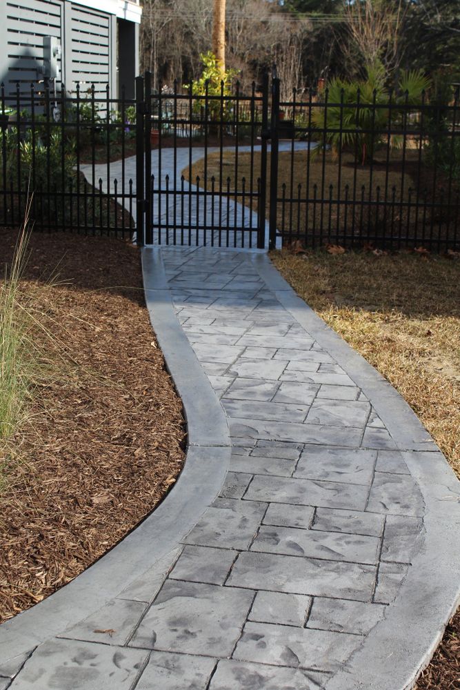 Enhance your home's appeal with our expert stamped concrete installation service, offering durable, stylish designs that mimic natural stone or pavers while providing a cost-effective and low-maintenance solution for patios and driveways. for D&L Concrete in Whitmore Lake, MI