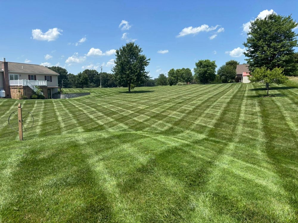 Our Lawn Maintenance service ensures your yard stays lush and healthy with expert mowing, trimming, fertilization, and season-specific care to enhance your home's curb appeal all year round. for Backyard Acres Lawncare LLC in Chambersburg, PA