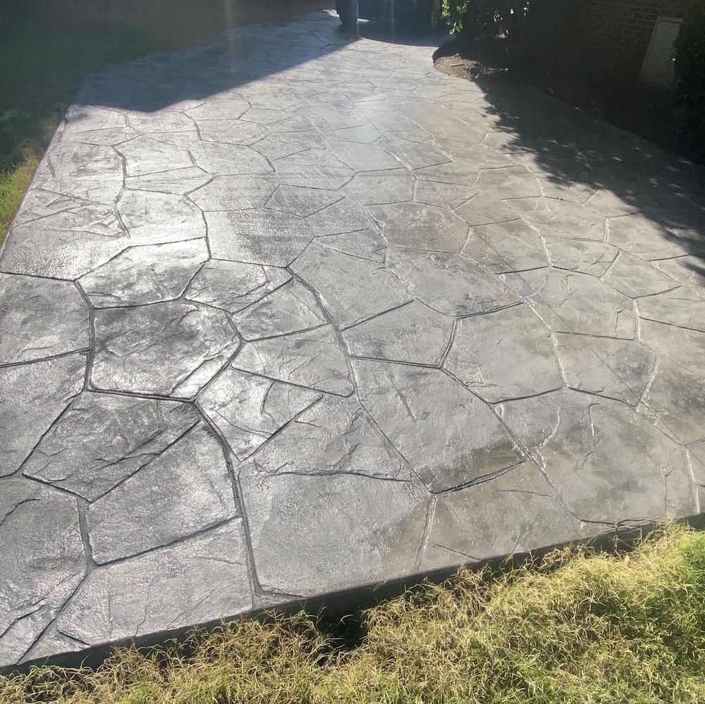 Our professional Stamped Concrete Installation service offers homeowners a durable and customizable option for enhancing the aesthetics of their outdoor spaces with beautiful patterns and textures. for Compadres Concrete in Griffin, GA