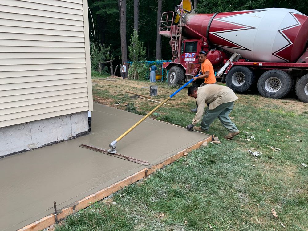 Our Concrete Slabs service offers homeowners a durable and affordable solution for adding or replacing pathways, patios, driveways or any other outdoor space requiring a strong and long-lasting foundation. for Elyon Construction and Stoneworks LLC in Windsor, CT