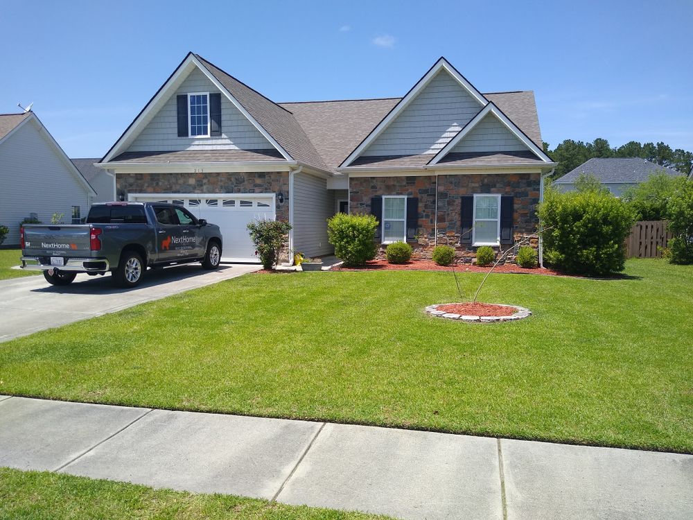 Transform your outdoor space with our expert Landscape Design service, creating personalized, beautiful landscapes that blend aesthetics and functionality to enhance your home's curb appeal and increase property value. for Voilà Magic LawnCare Services in Jacksonville, NC