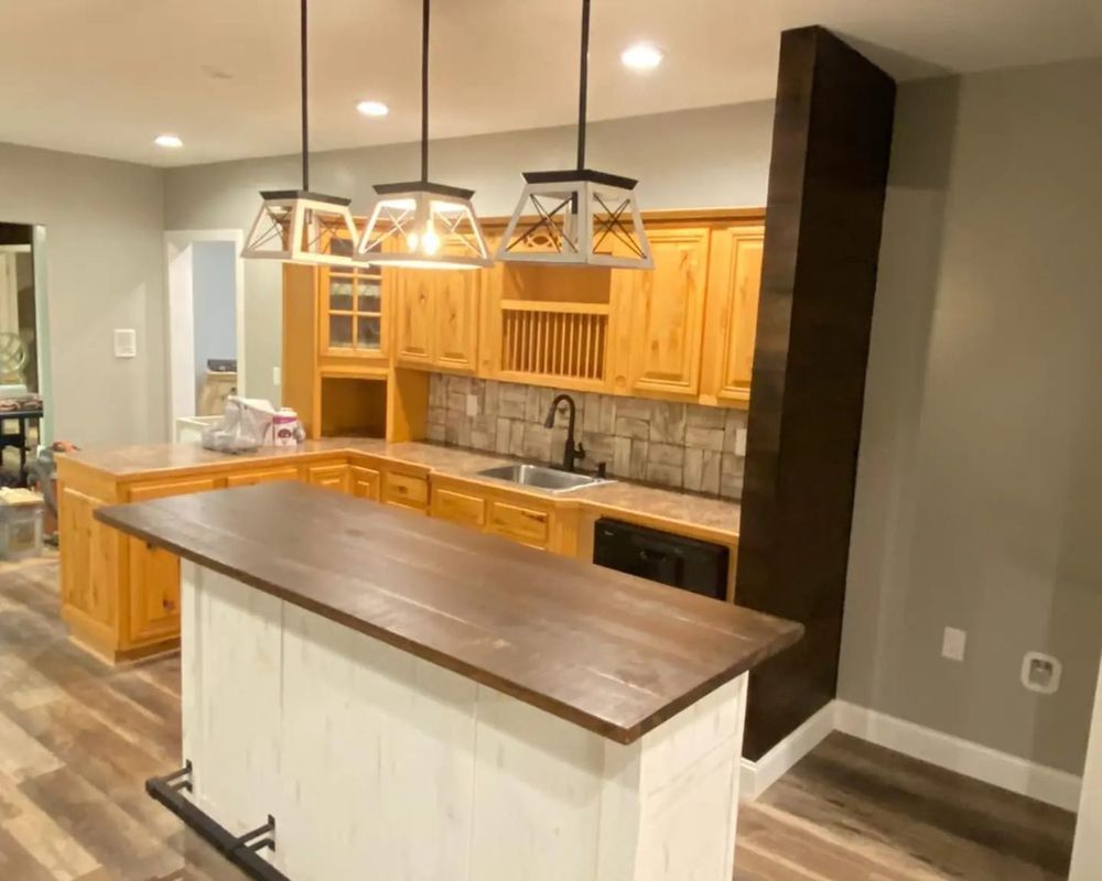 Transform your kitchen into a functional and stylish space with our expert renovation service. From custom cabinets to modern appliances, we'll bring your dream kitchen to life with precision and quality craftsmanship. for Blue Expert Remodeling in Ellijay, GA