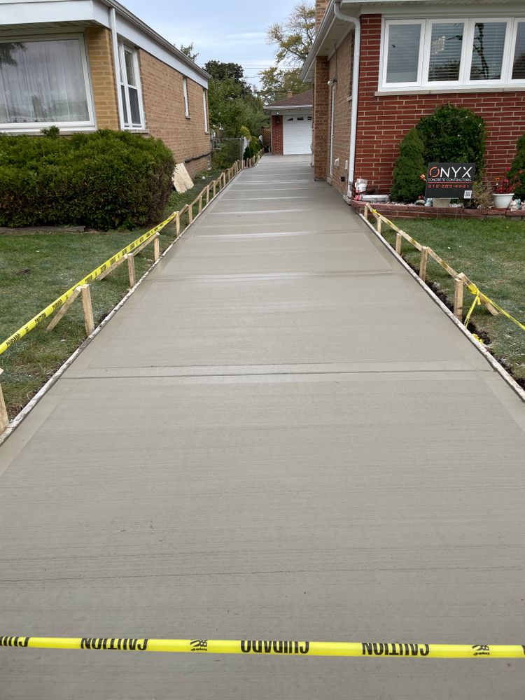 Our concrete services offer tailored solutions for durable and visually appealing driveways. Enhance your home's curb appeal and value with our high-quality materials and skilled craftsmanship. for Onyx Concrete Contractors in Chicago, IL