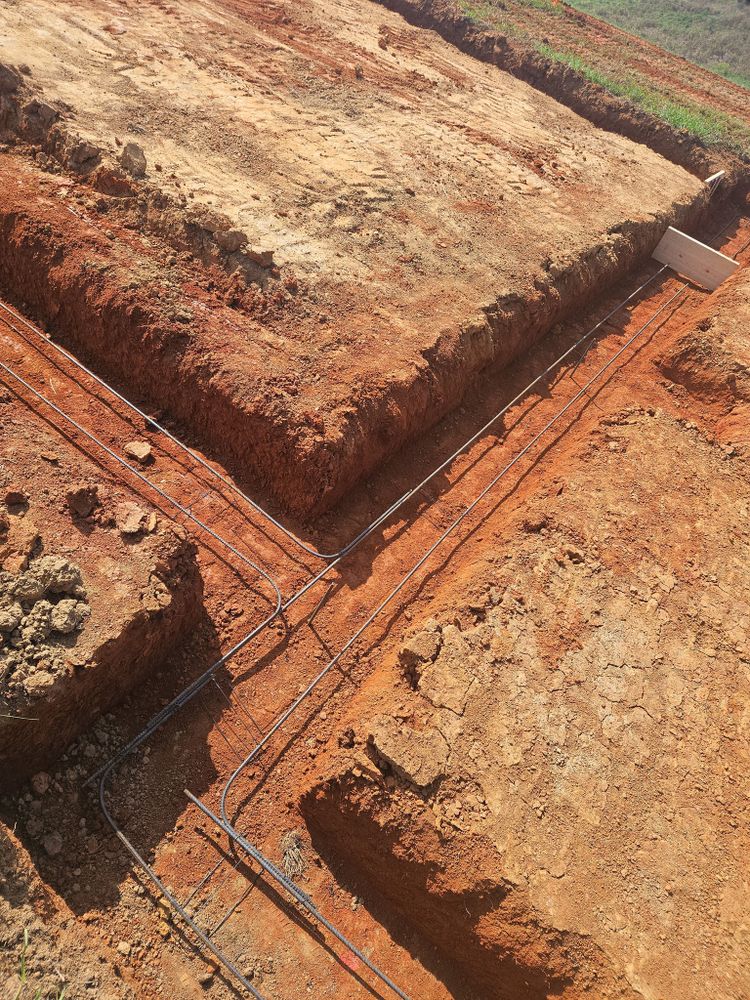 Our trenching service provides precise and efficient excavation for installing utilities, drainage systems, and more. We ensure minimal disruption to your property while delivering reliable results for all your home projects. for Bledsoe & Sons Excavating and Developing in Dandridge, TN