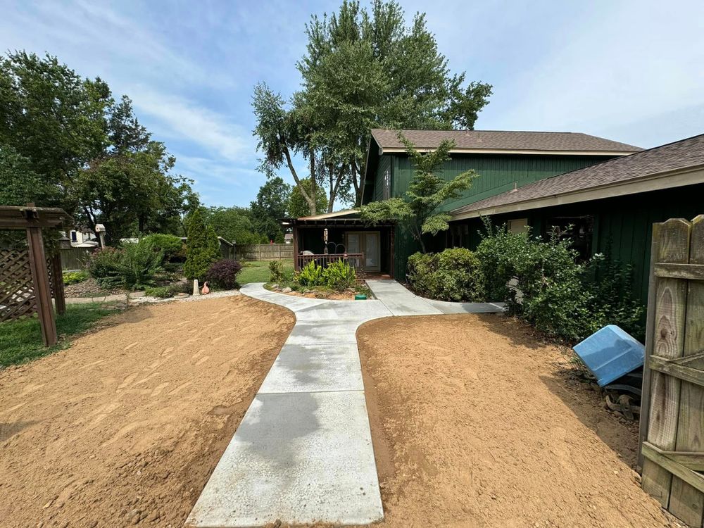 Enhance your property's curb appeal with our professional sidewalk installation service. Our expert team ensures durable, aesthetically pleasing concrete pathways that elevate safety and complement your home's design beautifully. for Apex Contractors LLC in Fayetteville, AR