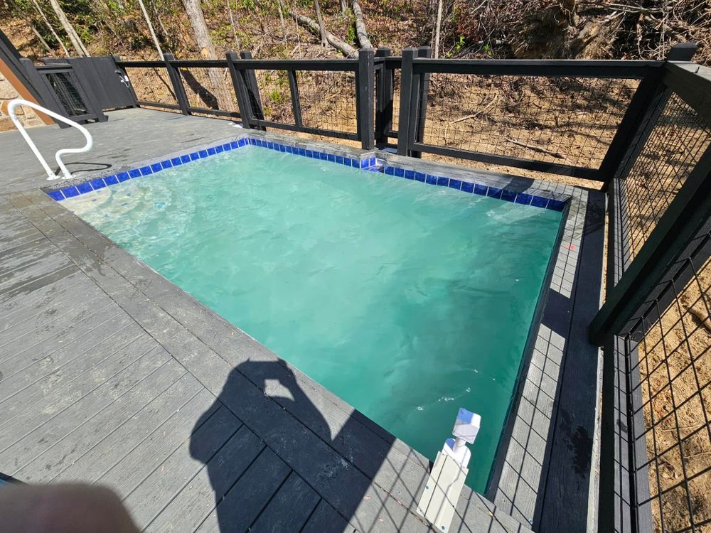 experience luxury and elegance with our Infinity Pool Construction service, crafting stunning pools that seamlessly blend into the horizon. Transform your backyard into a breathtaking oasis of tranquility and style. for Grasshopper Excavating & Pools in Pigeon Forge, TN