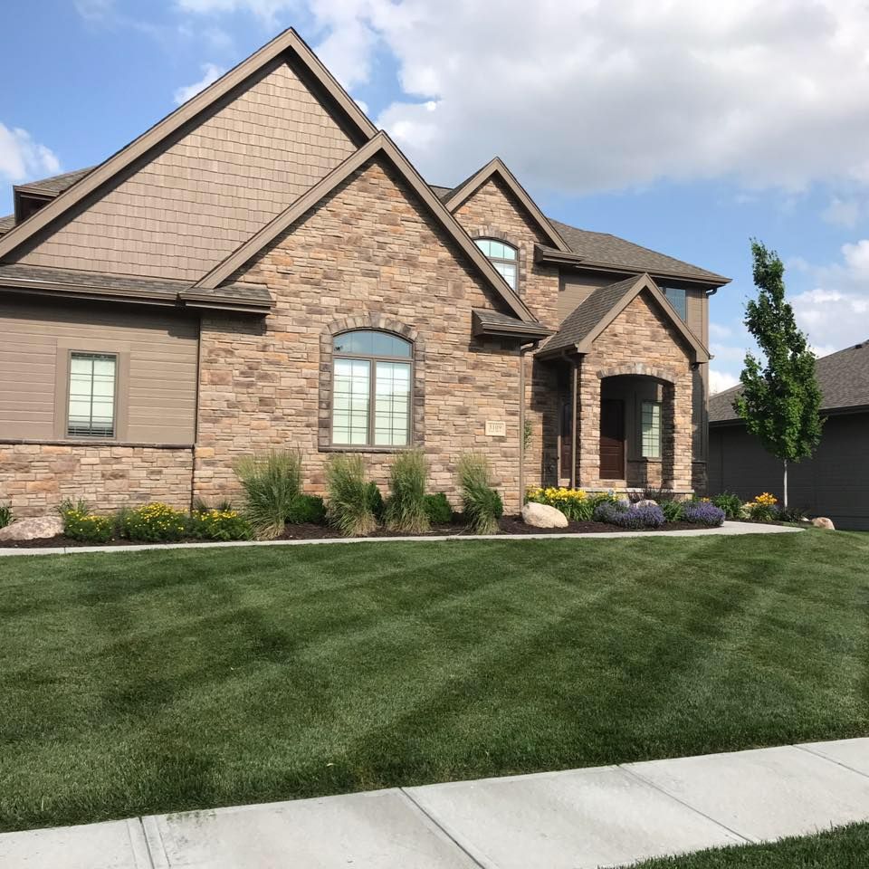 Our fertilizer service ensures lush and healthy lawns by supplying essential nutrients to your soil, promoting strong growth and vibrant greenery for a beautiful landscape. for Lawn Pros in Omaha, NE