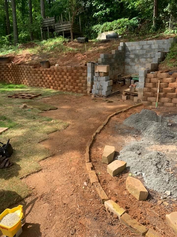 Enhance your outdoor space with our expert retaining wall construction services, offering durability and style while preventing soil erosion, optimizing land use, and adding a visually appealing structural element to your landscape design. for Bega Landscape Services in Atlanta, Georgia