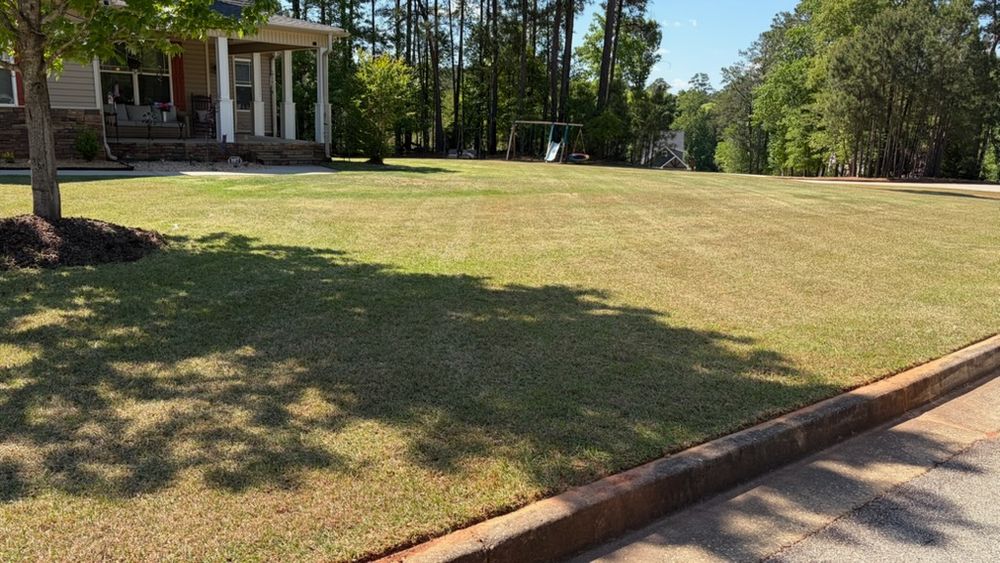 Our Lawn Maintenance service keeps your yard healthy, neat, and beautiful with mowing, edging, trimming, seasonal care, and dependable attention that enhances curb appeal and saves you time year-round. for Cooley’s Exterior Property Solutions  in Jackson, GA