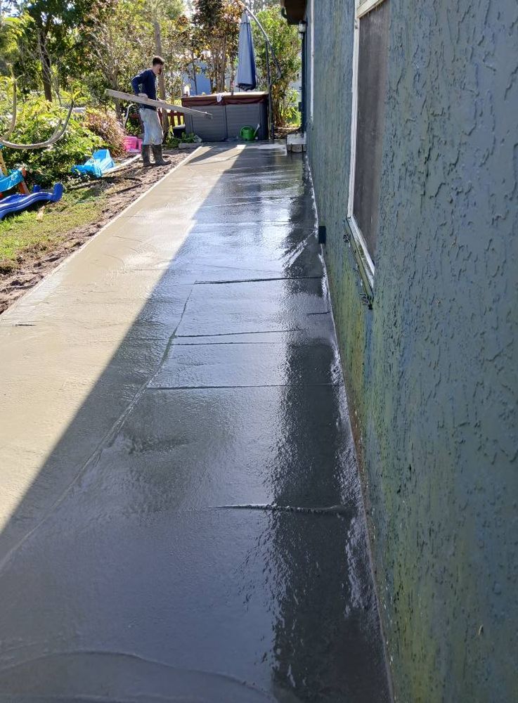 Our Sidewalk Installation service offers durable, expertly crafted walkways that enhance your home's curb appeal and ensure safe pedestrian access. Trust our skilled team for reliable installation and exceptional customer satisfaction. for Harris Sons Construction INC in Stuart, FL