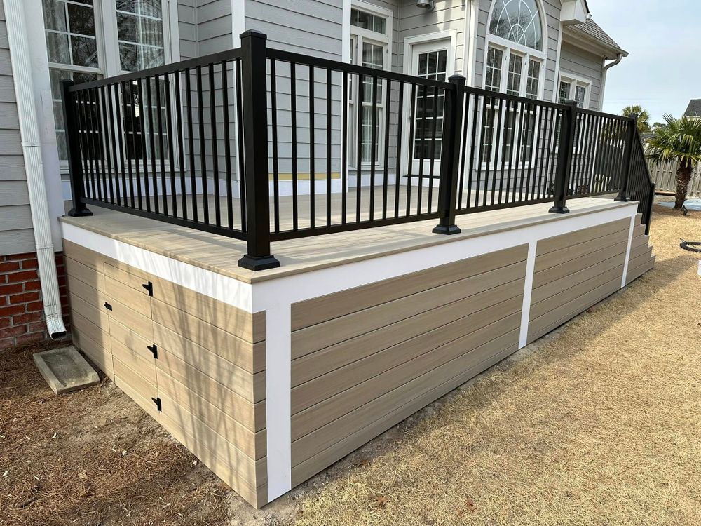 Enhance your outdoor living space with our expert Deck & Patio Installation services. We design and build durable, stylish decks and patios tailored to complement your home’s aesthetic while ensuring functionality. for Southeastern Property Solutions in Wilmington, NC