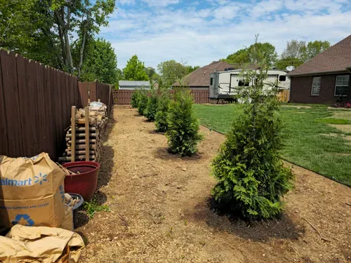 Our Mulch Installation service includes spreading high-quality mulch around your garden beds to improve soil health, suppress weeds, retain moisture, and enhance the overall appearance of your landscaping. for Lawnscapers TN in White House, TN