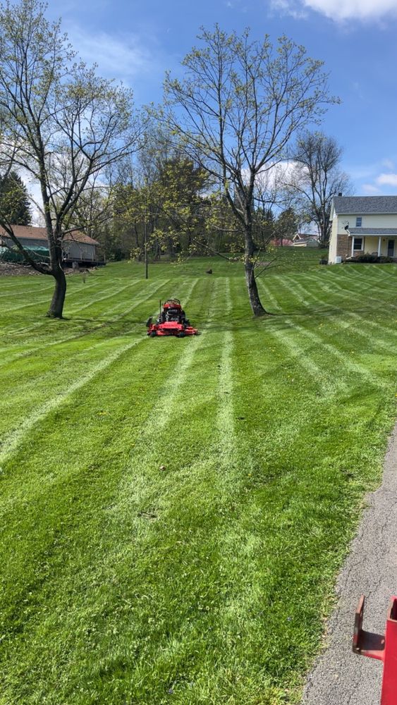 Our professional mowing service ensures a pristine, well-manicured lawn with precision trimming and edging, enhancing your home's curb appeal while promoting healthy grass growth for a lush outdoor landscape. for Duff’s Lawncare in Prospect, PA