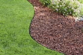 Our Mulch Installation service enhances your landscaping by adding a layer of mulch that improves soil quality, retains moisture, suppresses weeds, and gives a polished look to your outdoor space. for Exterior Design Landscape Services in Americus, GA