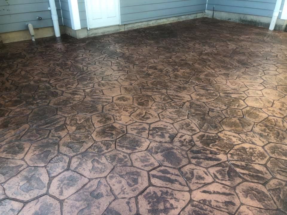 We offer stamped concrete installation to enhance your home's aesthetic appeal with customizable patterns and designs, providing a durable and cost-effective option for driveways, patios, and walkways. for Rasmussen Concrete in Appleton, WI