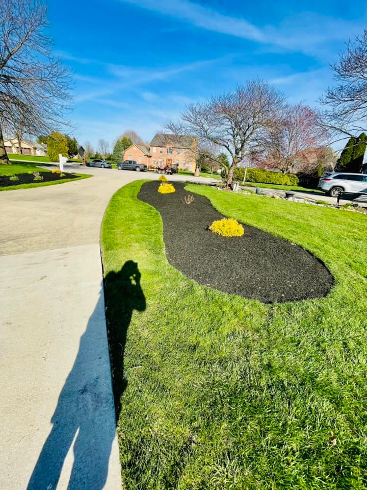 Our Mulch Installation service provides a cost-effective and aesthetically pleasing way to improve the health of your landscape by suppressing weeds, retaining moisture, and adding nutrients to the soil. for Manny's Cleaning,Lawn Care & Snow Removal Services in Champaign, IL