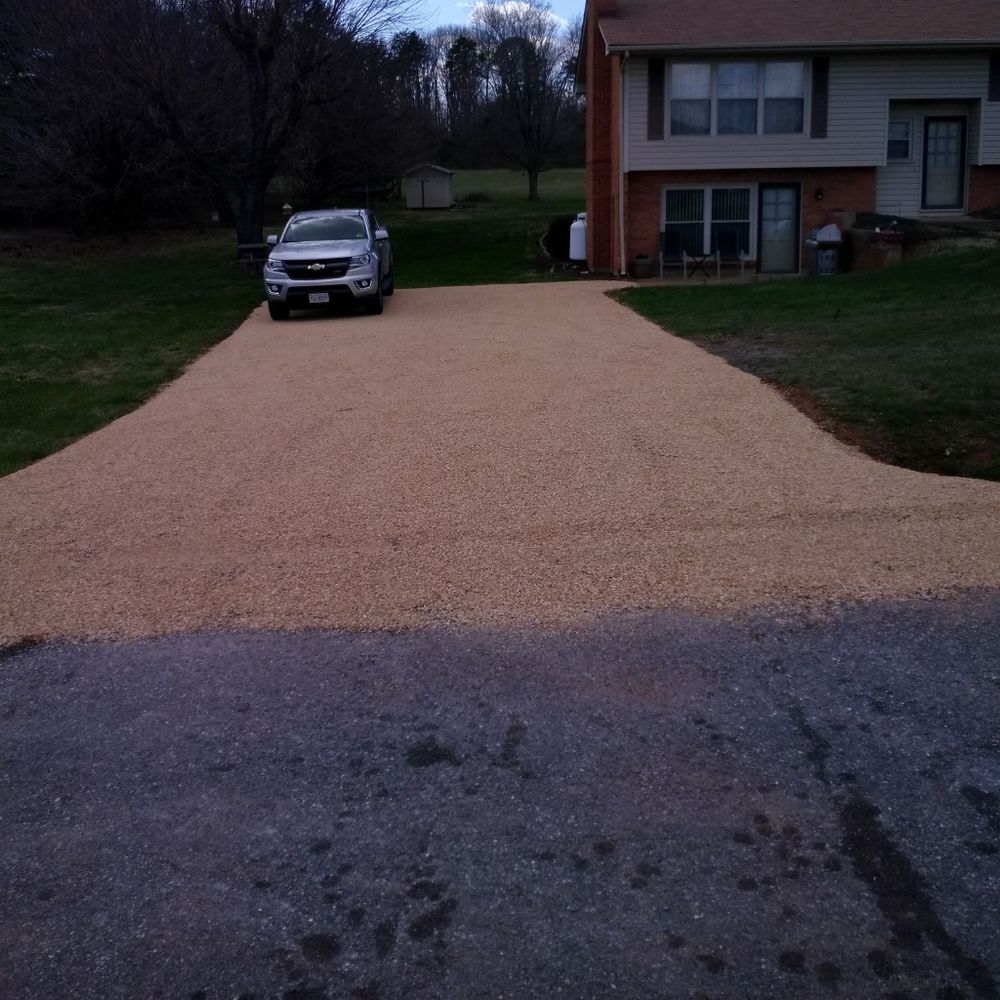 Our driveway paving service delivers durable, smooth asphalt surfaces with expert craftsmanship and timely completion, enhancing your home's curb appeal and ensuring long-lasting performance under various weather conditions. for Allstate Asphalt & Concrete in Lynchburg, VA